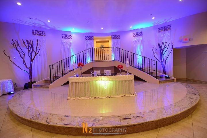 Stage with purple accent lighting at La Fontaine Original Venue